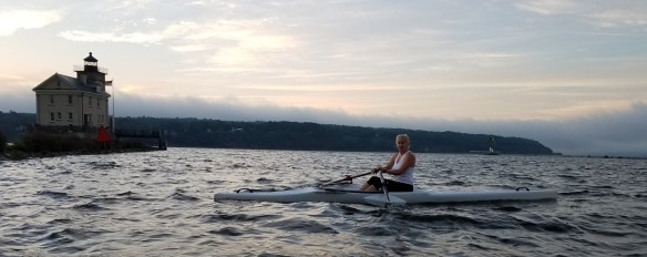 me at lighthouse in rough waters